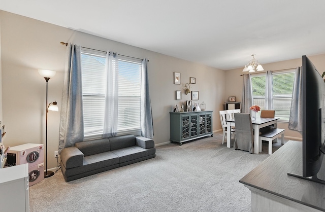 2421 Sand Hills Dr, Papillion, NE 68046 - carpeted living room featuring a chandelier and baseboards