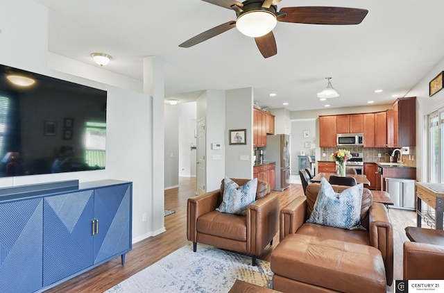 2421 Sand Hills Dr, Papillion, NE 68046 - living area with light wood-type flooring, ceiling fan, baseboards, and recessed lighting