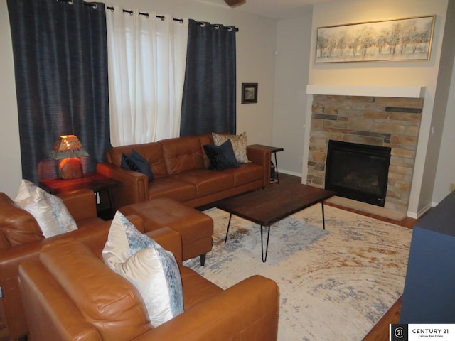 2421 Sand Hills Dr, Papillion, NE 68046 - living room featuring baseboards, wood finished floors, and a stone fireplace