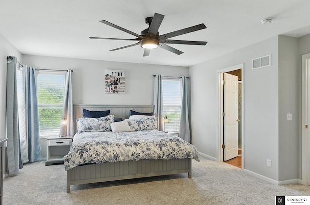 2421 Sand Hills Dr, Papillion, NE 68046 - bedroom featuring multiple windows, light carpet, baseboards, and ceiling fan