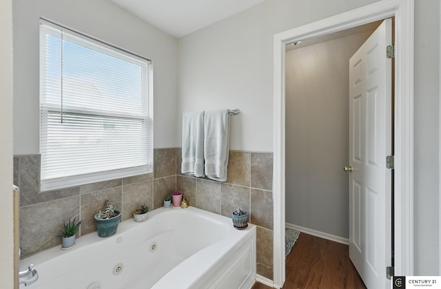 2421 Sand Hills Dr, Papillion, NE 68046 - full bath featuring a whirlpool tub, wood finished floors, and baseboards