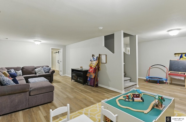 2421 Sand Hills Dr, Papillion, NE 68046 - living area with wood finished floors, stairway, and baseboards