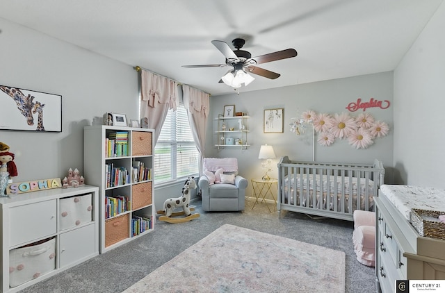 2421 Sand Hills Dr, Papillion, NE 68046 - bedroom featuring a crib, carpet floors, and ceiling fan