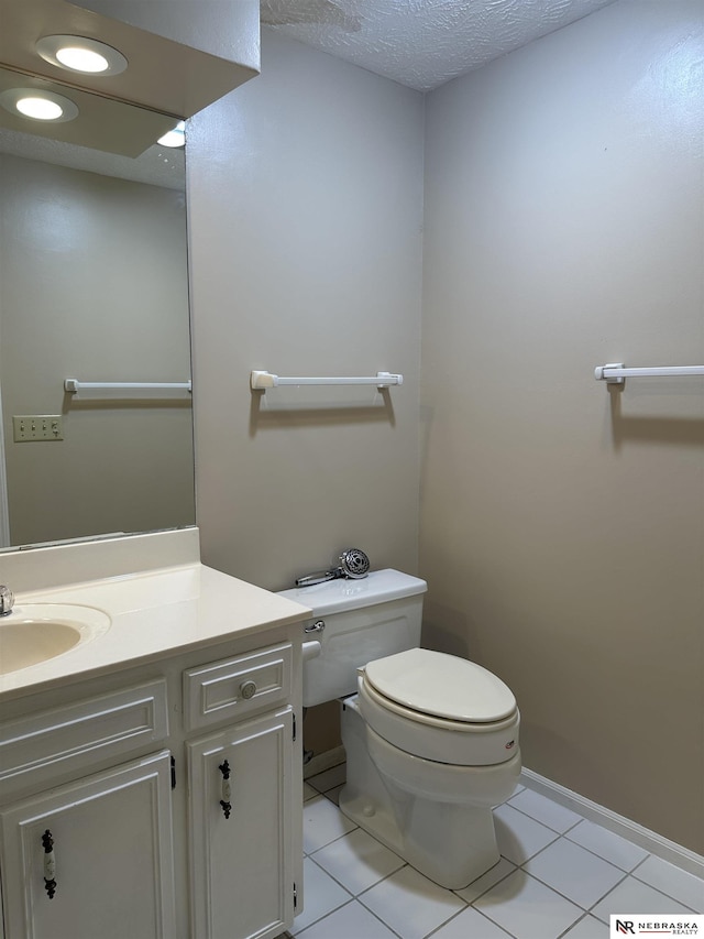 1605 S 113th Plz, Omaha, NE 68144 - bathroom featuring toilet, vanity, tile patterned floors, and baseboards