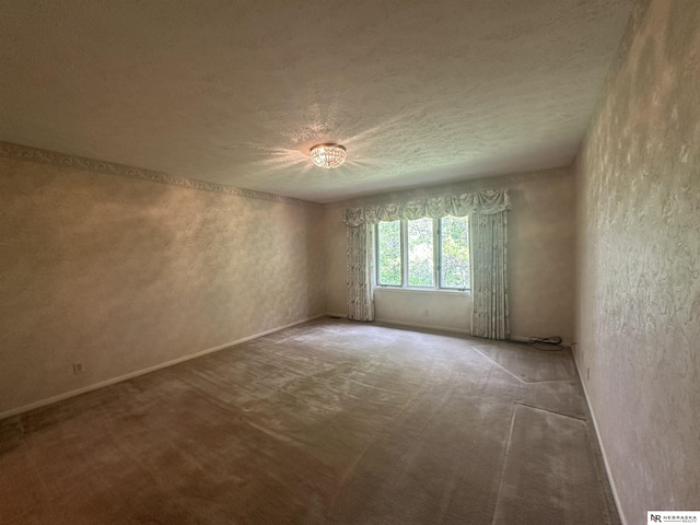 1605 S 113th Plz, Omaha, NE 68144 - carpeted spare room featuring a textured wall, a textured ceiling, and baseboards
