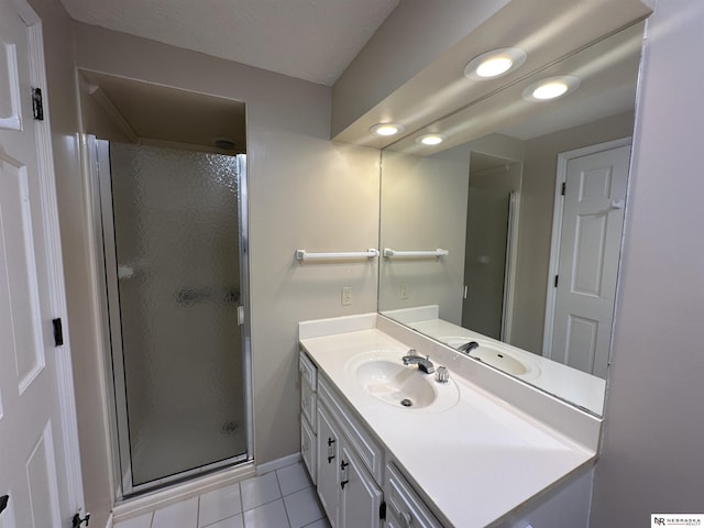 1605 S 113th Plz, Omaha, NE 68144 - full bath with a shower stall, vanity, and tile patterned flooring