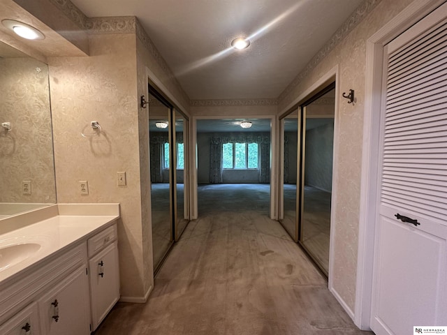 1605 S 113th Plz, Omaha, NE 68144 - full bath featuring vanity, baseboards, and a closet