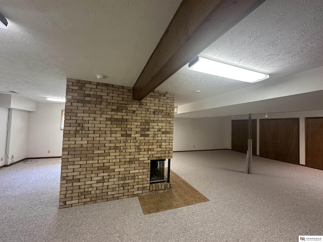 1605 S 113th Plz, Omaha, NE 68144 - finished below grade area with a textured ceiling, carpet, a brick fireplace, baseboards, and brick wall