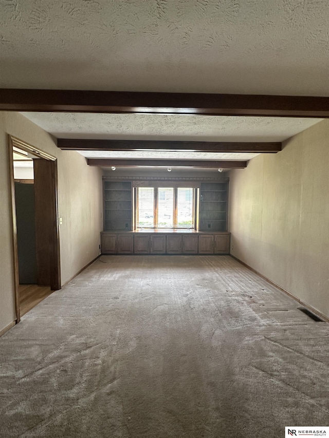 1605 S 113th Plz, Omaha, NE 68144 - carpeted spare room featuring beamed ceiling and a textured ceiling