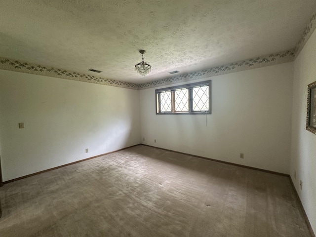 1605 S 113th Plz, Omaha, NE 68144 - carpeted spare room featuring a textured ceiling and baseboards