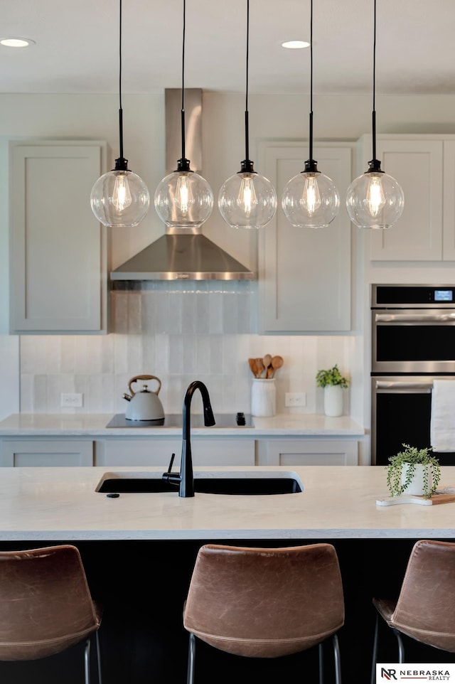 612 N 107th St, Lincoln, NE 68527 - kitchen with double oven, decorative light fixtures, and decorative backsplash
