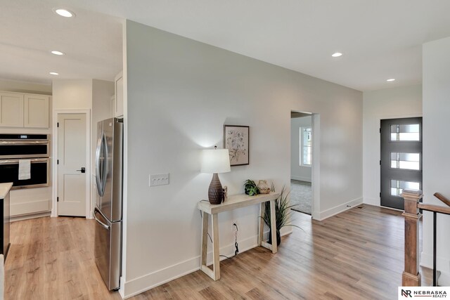 612 N 107th St, Lincoln, NE 68527 - foyer with recessed lighting, light wood-style floors, and baseboards