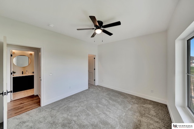 612 N 107th St, Lincoln, NE 68527 - unfurnished bedroom with carpet, baseboards, and ceiling fan