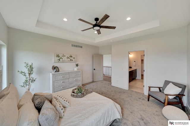 612 N 107th St, Lincoln, NE 68527 - bedroom with a raised ceiling, recessed lighting, carpet floors, baseboards, and ensuite bathroom