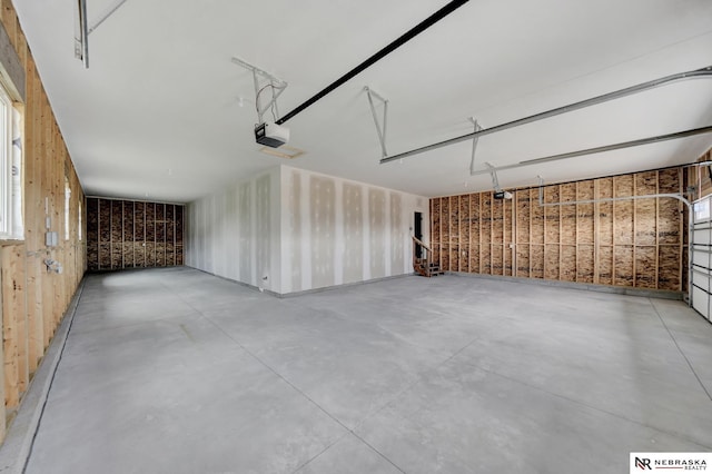 612 N 107th St, Lincoln, NE 68527 - garage with a garage door opener and wooden walls