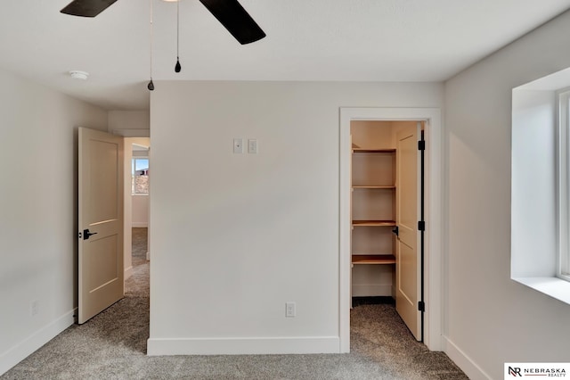612 N 107th St, Lincoln, NE 68527 - unfurnished bedroom featuring carpet flooring, a spacious closet, baseboards, and a closet