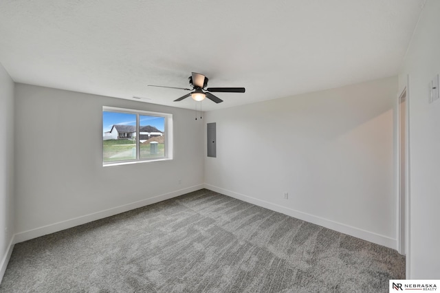 612 N 107th St, Lincoln, NE 68527 - spare room featuring a ceiling fan, electric panel, carpet floors, and baseboards