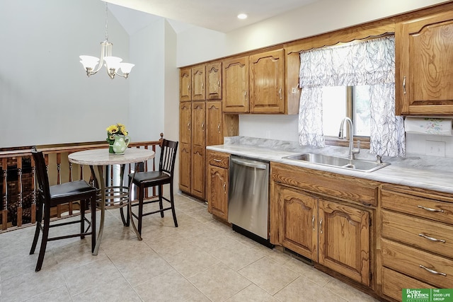 kitchen featuring dishwasher, a sink, brown cabinets, and light countertops
