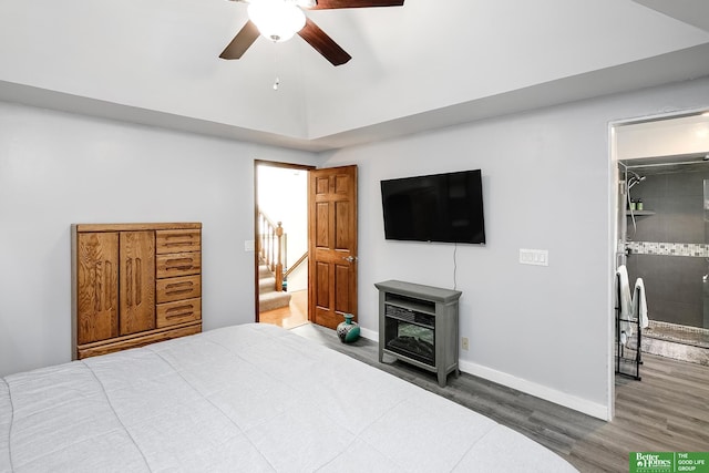 bedroom with wood finished floors, baseboards, and ceiling fan