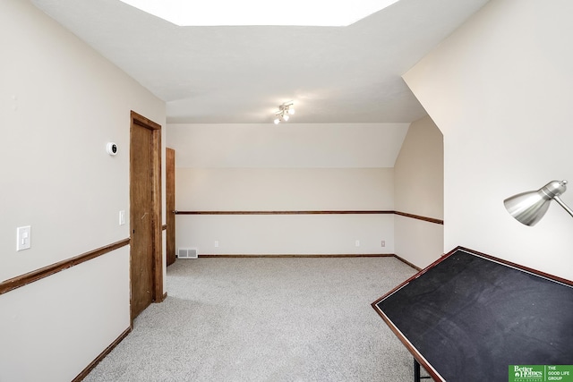 bonus room with carpet and baseboards
