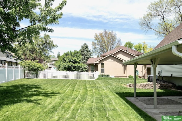 view of yard featuring cooling unit and a patio area