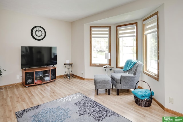 sitting room featuring wood finished floors and baseboards