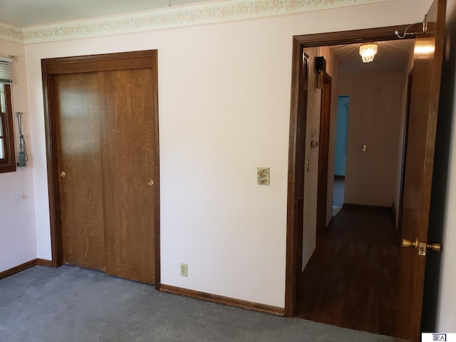 14930 Holmes St, Omaha, NE 68137 - unfurnished bedroom with a closet, carpet flooring, and baseboards