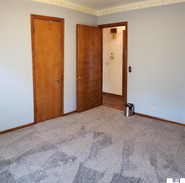 14930 Holmes St, Omaha, NE 68137 - unfurnished bedroom featuring carpet floors and baseboards