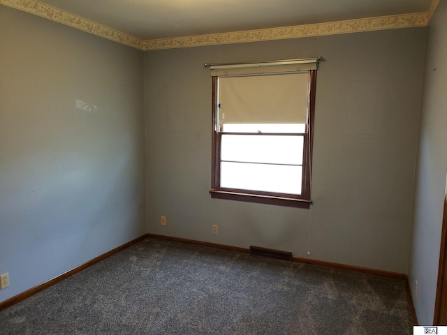 14930 Holmes St, Omaha, NE 68137 - spare room featuring dark colored carpet and baseboards