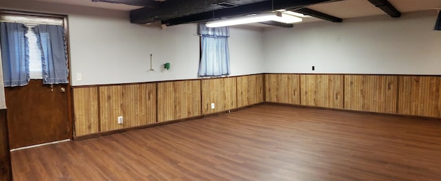 14930 Holmes St, Omaha, NE 68137 - below grade area with wood finished floors, a wainscoted wall, and wood walls