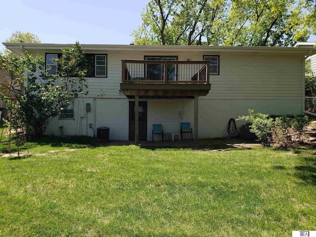14930 Holmes St, Omaha, NE 68137 - rear view of property with a balcony, a lawn, and central AC unit