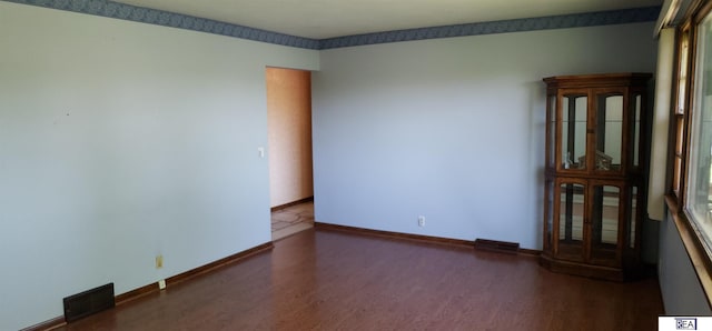 14930 Holmes St, Omaha, NE 68137 - unfurnished room with wood finished floors and baseboards
