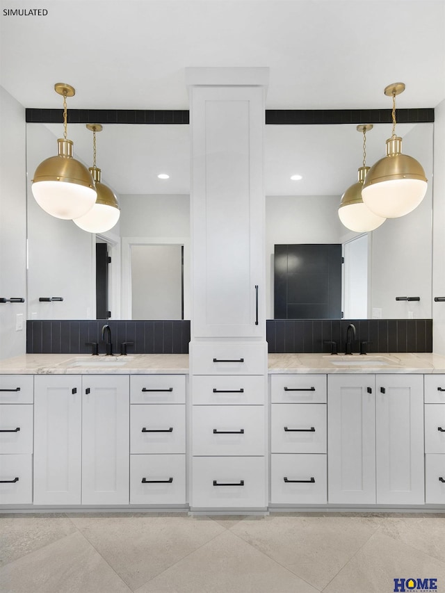 bathroom with two vanities and decorative backsplash