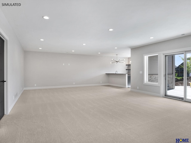 unfurnished living room featuring light colored carpet, recessed lighting, a chandelier, and baseboards