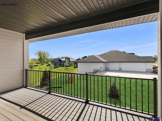 wooden deck featuring a residential view and a yard