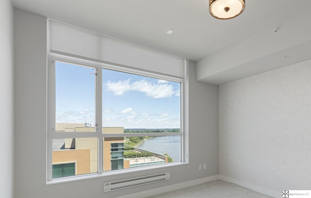 444 Riverfront Plz Unit 801, Omaha, NE 68102 - empty room featuring a water view and baseboards