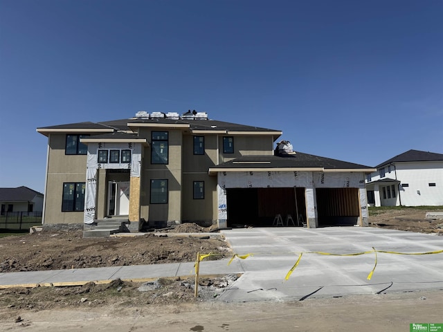 21108 Arlington St, Elkhorn, NE 68022 - view of front of house with concrete driveway, a garage, and fence
