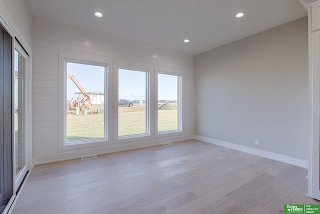 21108 Arlington St, Elkhorn, NE 68022 - unfurnished room with light wood-style flooring, healthy amount of natural light, recessed lighting, and baseboards