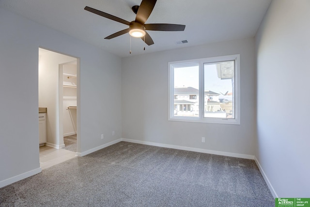 21108 Arlington St, Elkhorn, NE 68022 - empty room with light colored carpet, ceiling fan, and baseboards