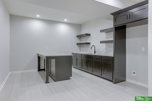 21108 Arlington St, Elkhorn, NE 68022 - kitchen with open shelves, tasteful backsplash, light countertops, recessed lighting, and a sink