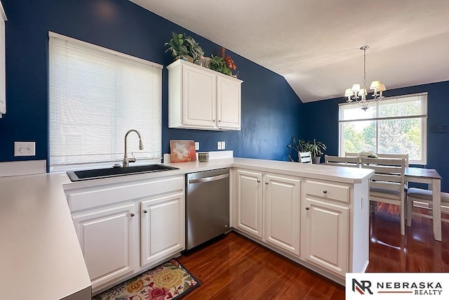 kitchen featuring dishwasher, a sink, lofted ceiling, a chandelier, and dark wood-style flooring