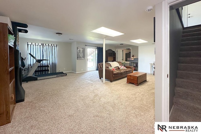 living area featuring stairs, carpet flooring, and baseboards