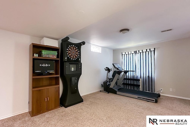 workout area with carpet floors and baseboards