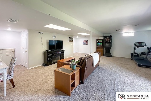 living room featuring light colored carpet and baseboards