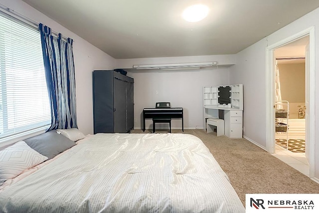 bedroom featuring carpet flooring and baseboards