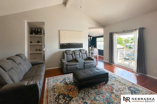 living area with wood finished floors and baseboards