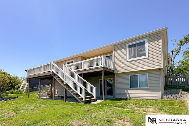 back of house featuring stairway and a deck
