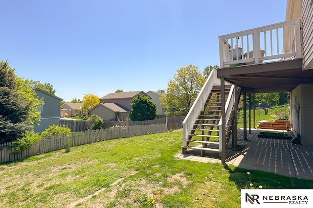 view of yard featuring stairway and a wooden deck