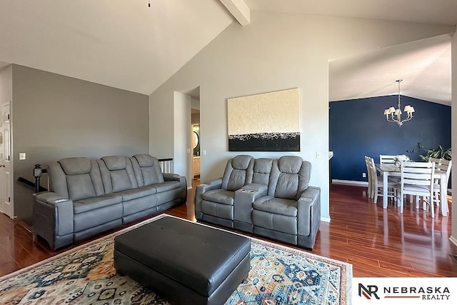 living area featuring wood finished floors, a chandelier, and baseboards