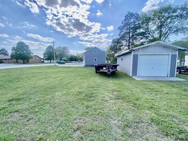 340 S Jefferson St, Bruning, NE 68322 - view of green lawn with an outbuilding and a garage